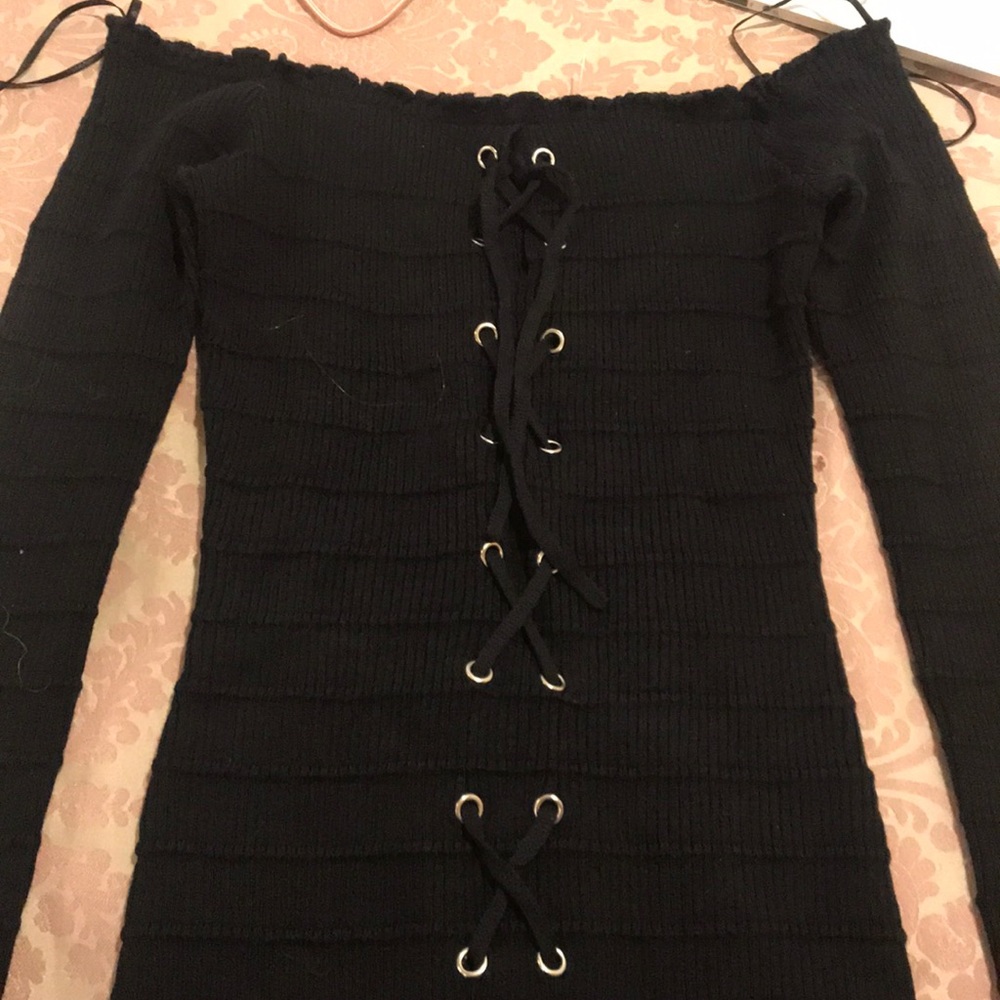 Black tight top off the shoulder